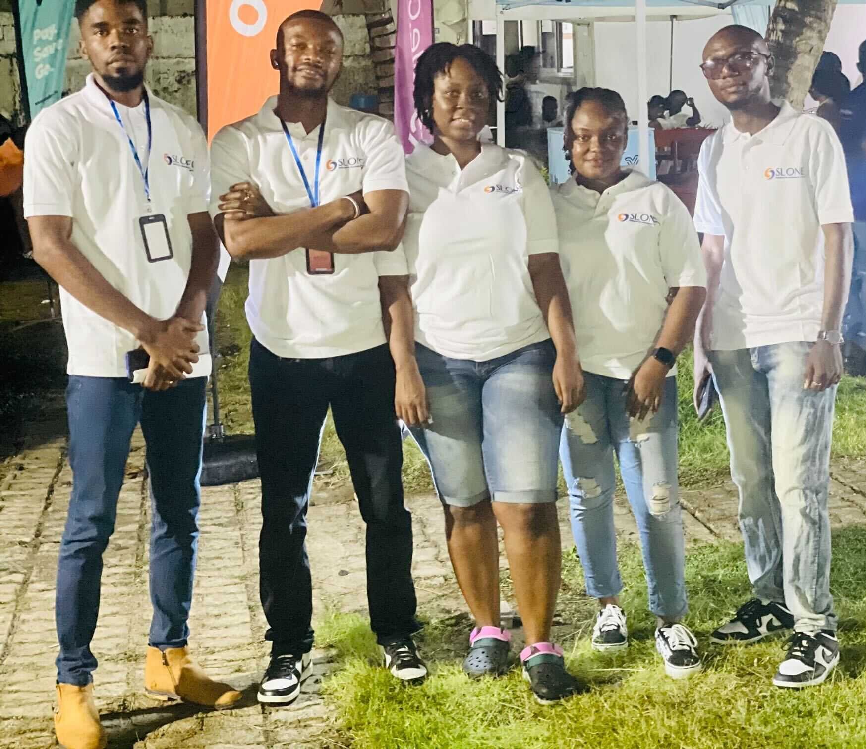 SLONEC team members at a community engagement event in Freetown
