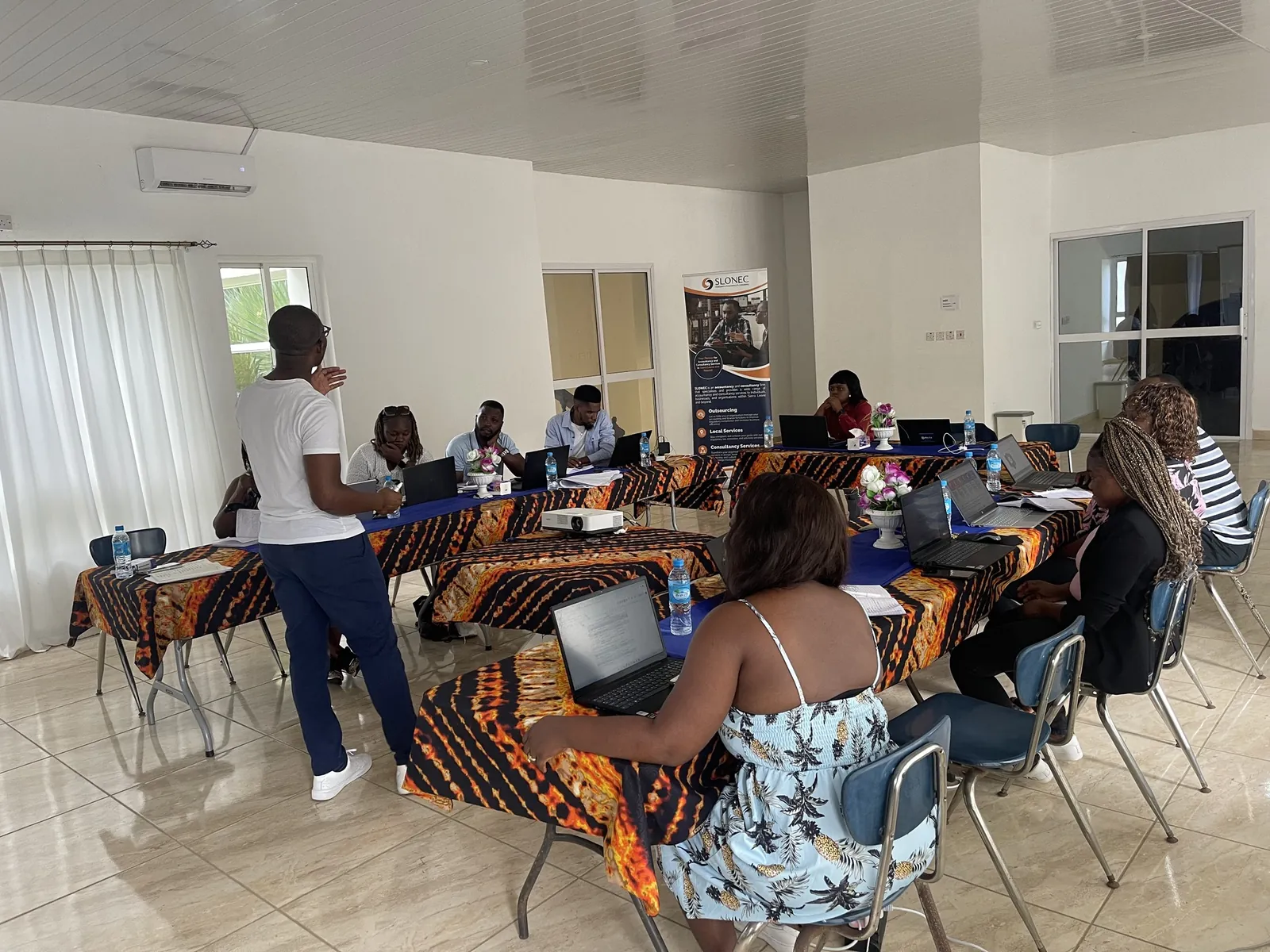 SLONEC staff working on laptops during the team retreat