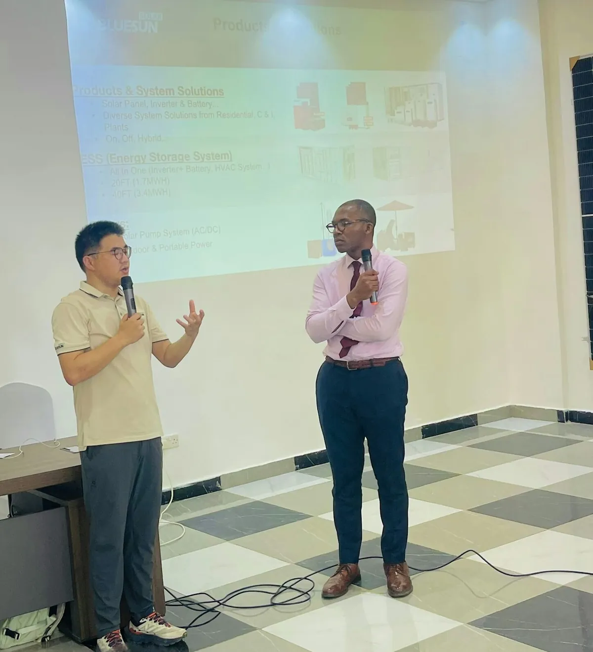 A speaker presenting at SLONEC's customer service celebration