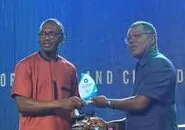 SLONEC receiving the Civic Champion Award 2024 on stage