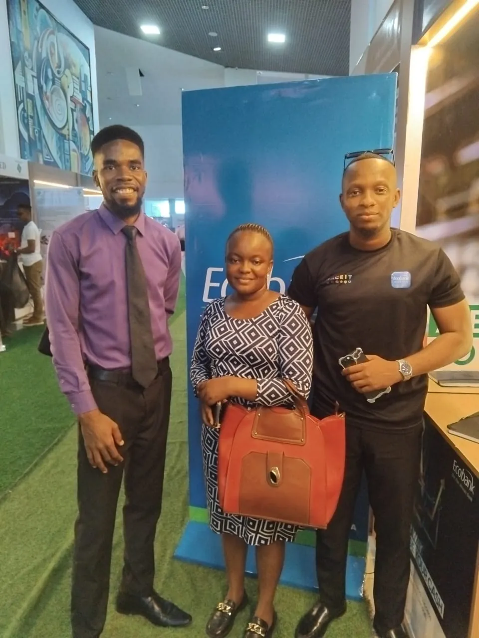 SLONEC staff with an exhibitor at Sierra Leone Mining Week 2025
