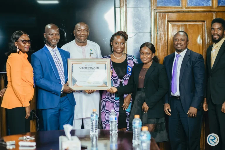 SLONEC presenting a certificate of honour to the Rokel Commercial Bank Managing Director