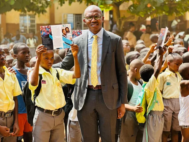 Ishmael Bangura with pupils during a SLONEC community visit