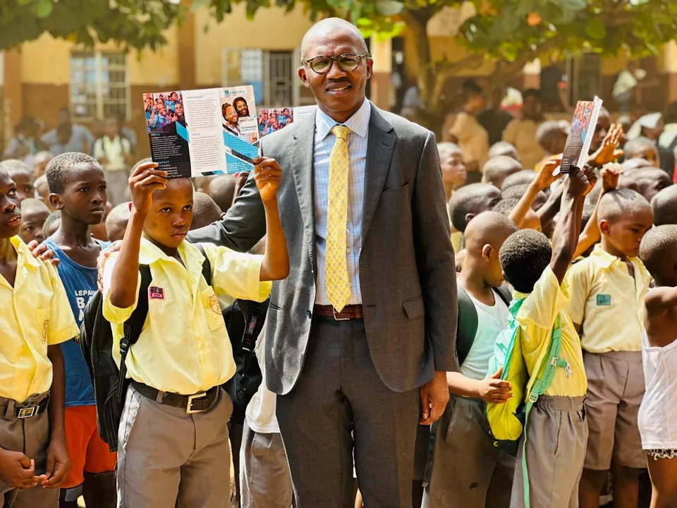 Ishmael Bangura with pupils during a SLONEC community visit