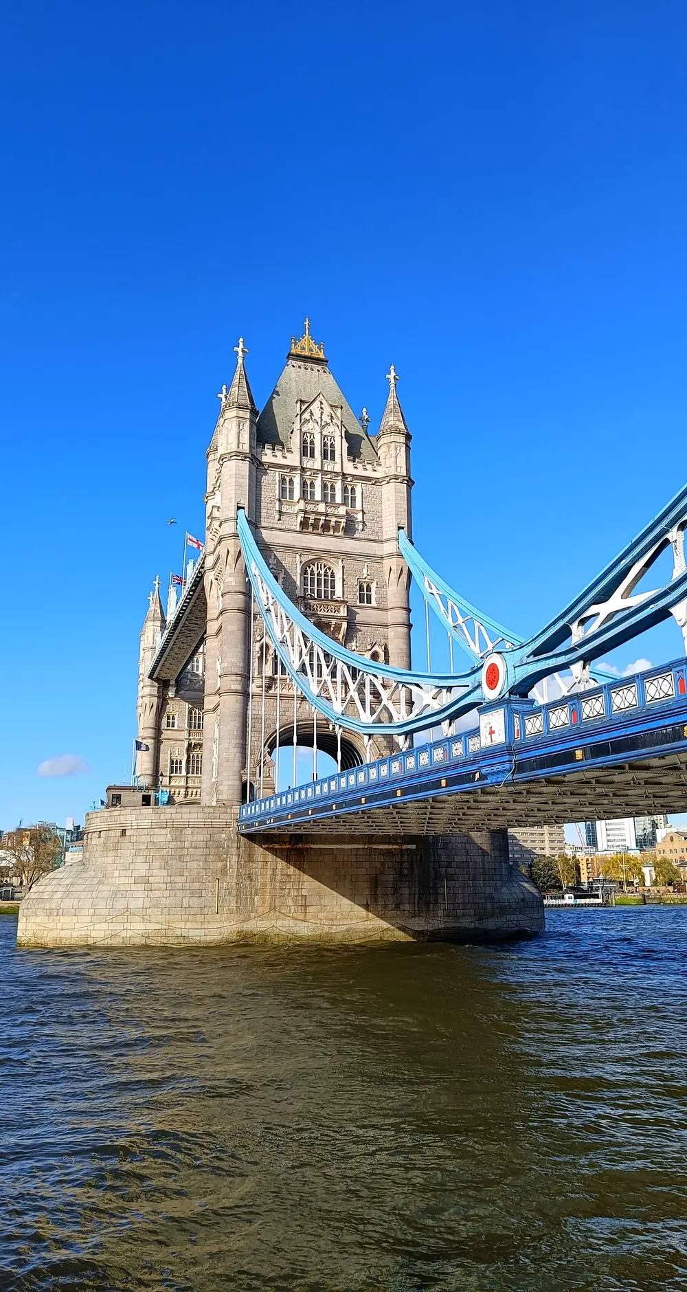 Tower Bridge and the River Thames in London under a clear blue sky