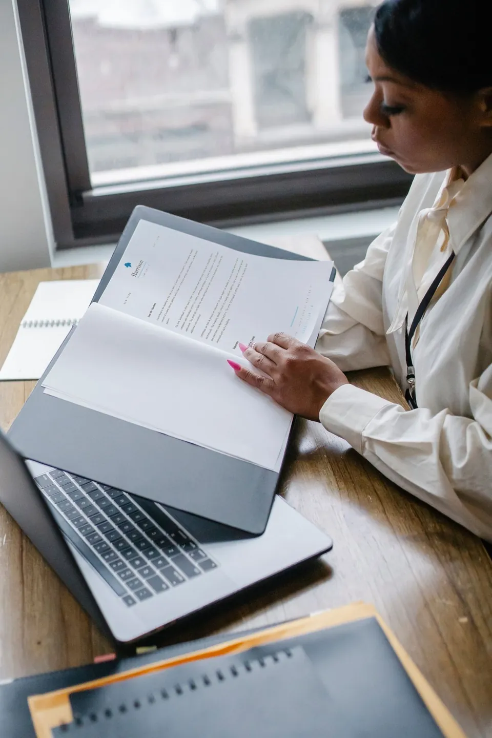 A finance officer working through a checklist