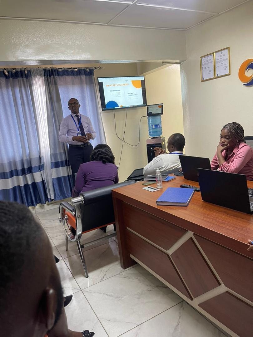 SLONEC adviser leading a team working session at the SLONEC office in Freetown