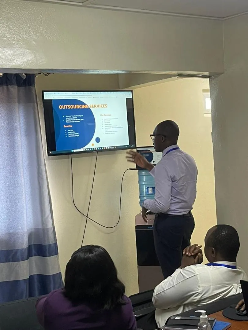 SLONEC consultant presenting a planning session to business owners in Freetown