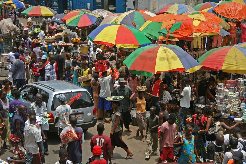 Traders and shoppers at a busy market in Freetown