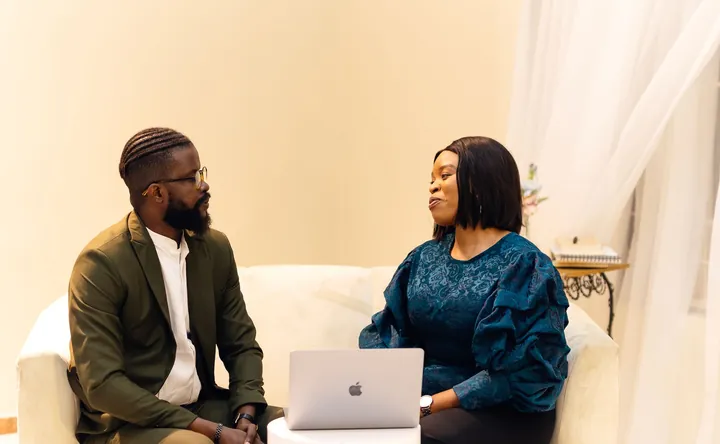 A business adviser in discussion with a client