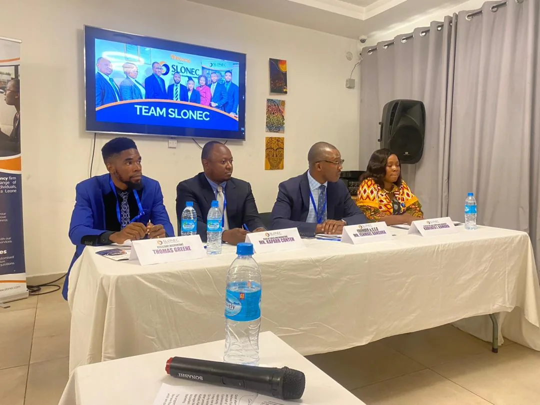 SLONEC press conference panel at the Swiss Hotel, Freetown, with Thomas Greene and Founder & CEO Ishmael Bangura at the table