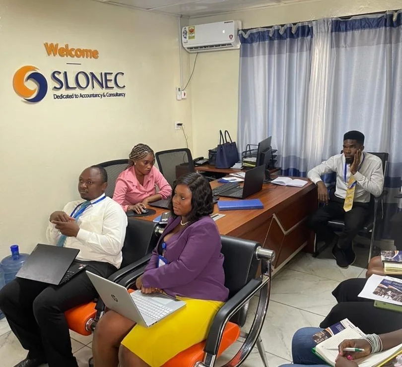 SLONEC staff at a training session in the SLONEC office in Freetown