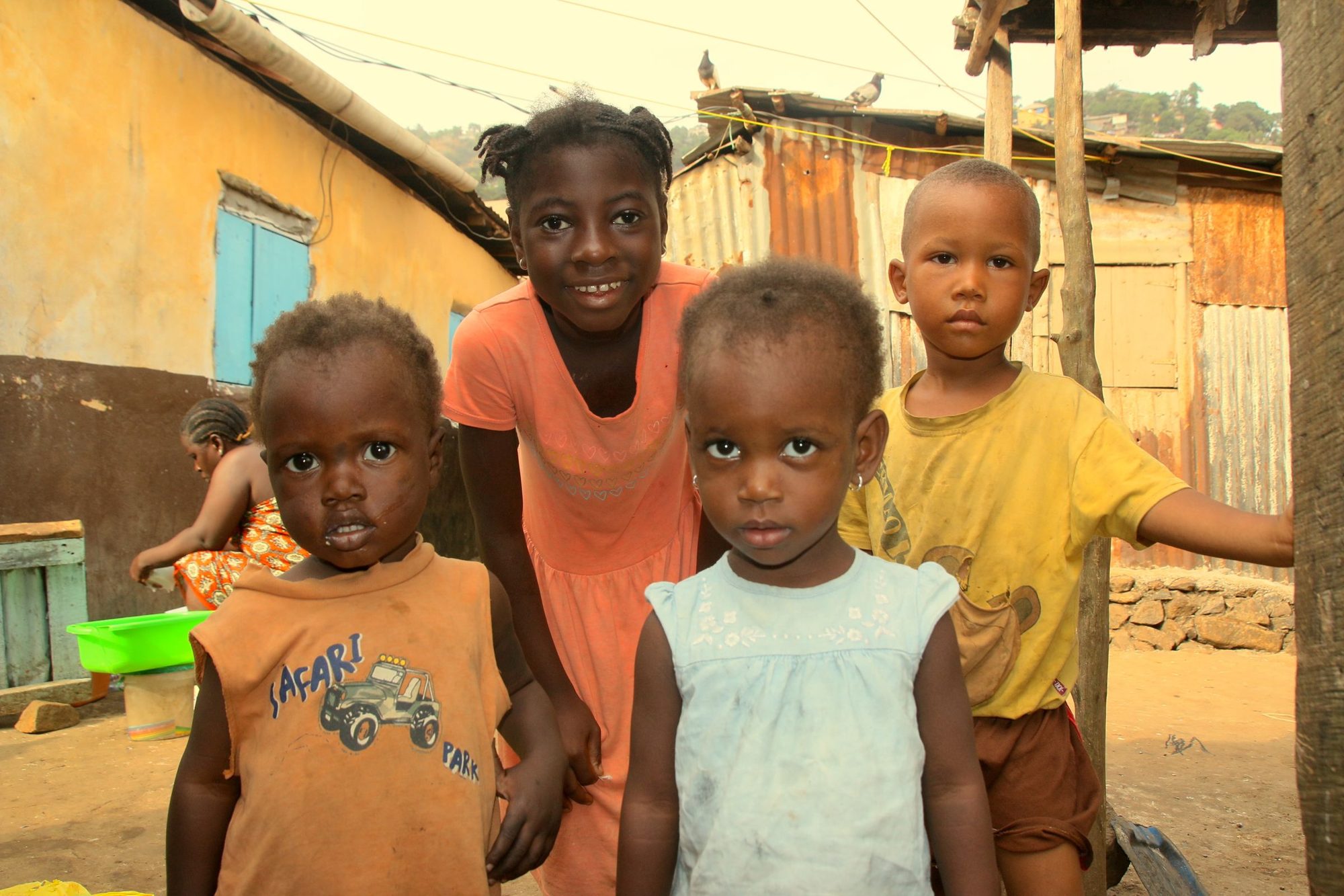 Children smiling in a Freetown neighbourhood, Sierra Leone